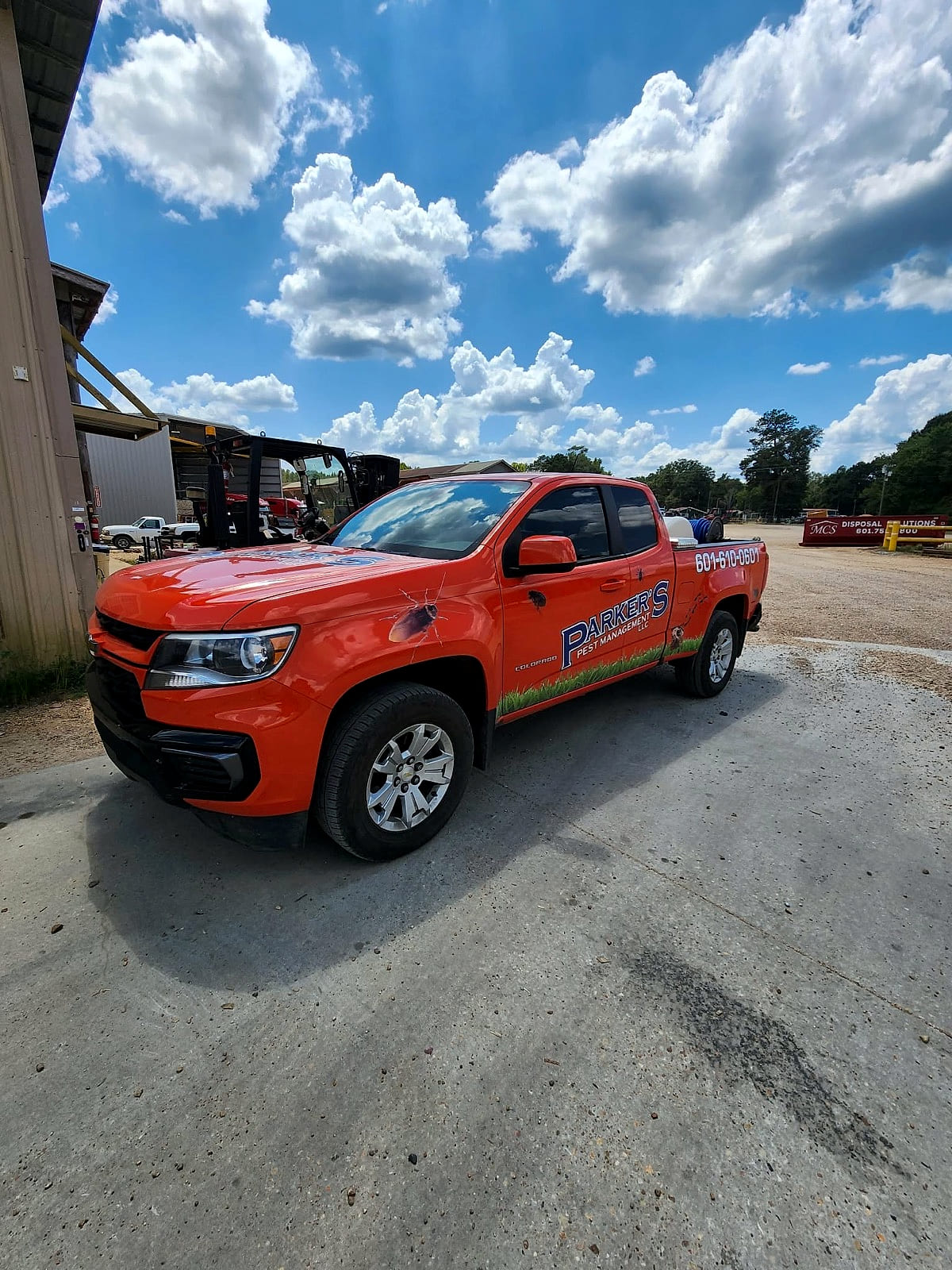 A Parker's Pest Management truck at a commercial property